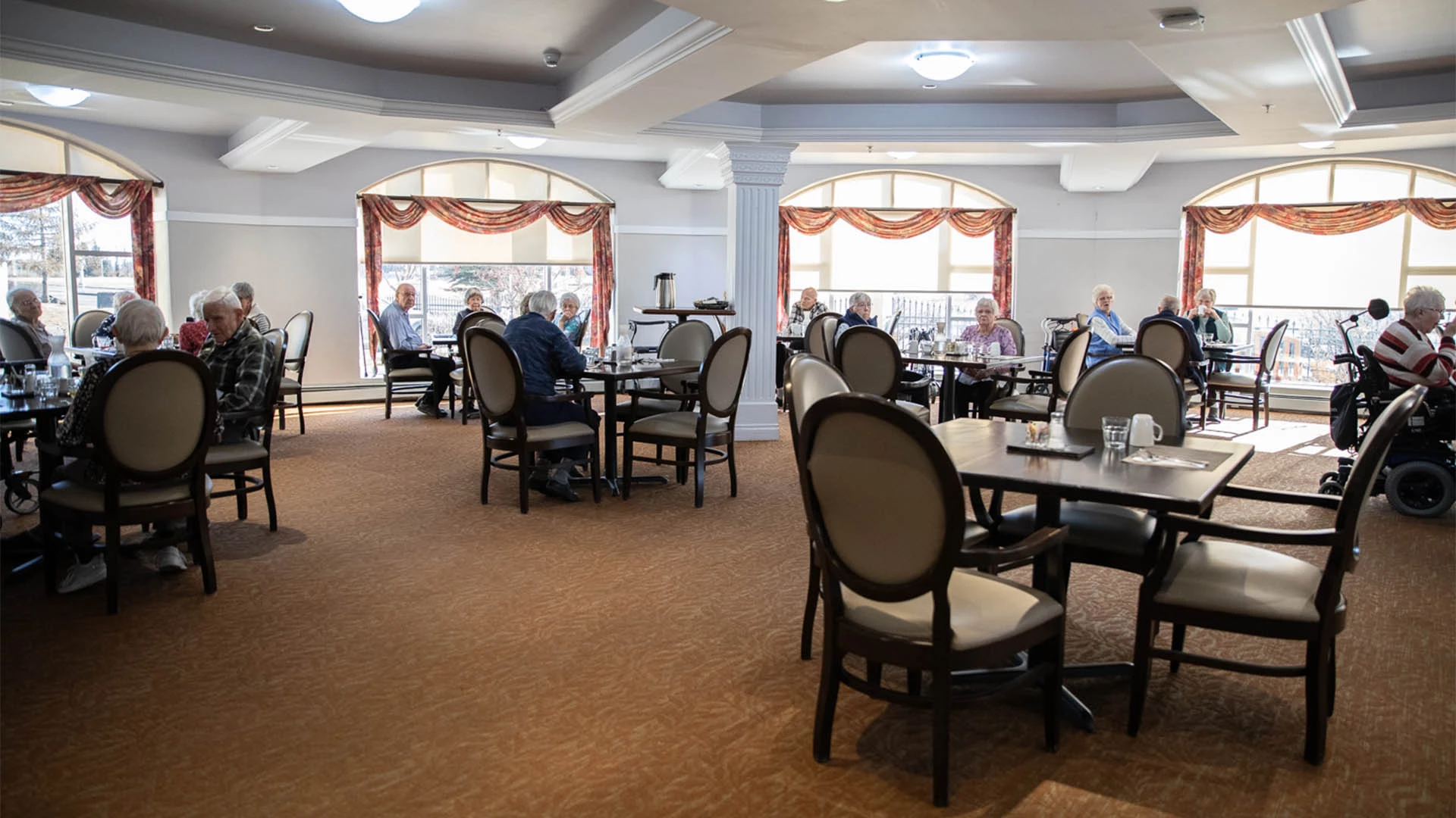 dining room with seniors sitting at tables